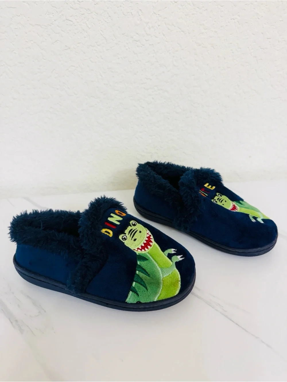 Navy Dinosaur Slippers with Faux Fur Lining and “Dino-Mite” Embroidery